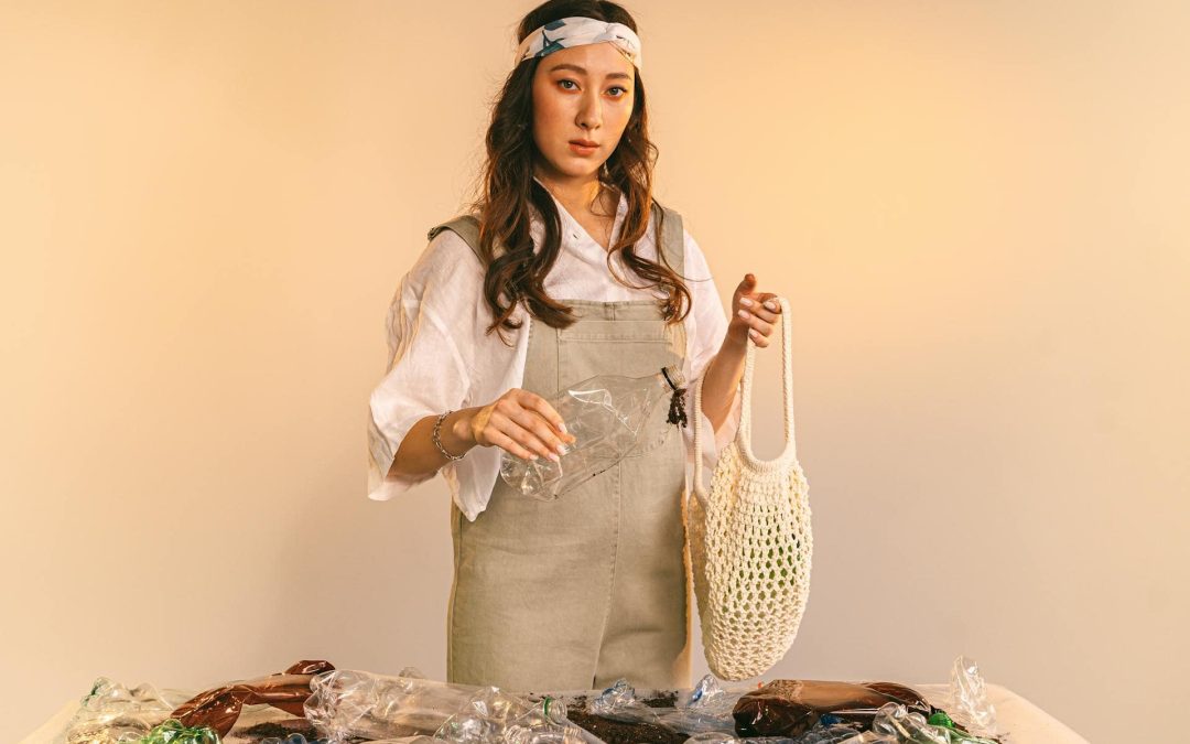 A Woman Holding a Plastic Bottle and a Mesh Bag